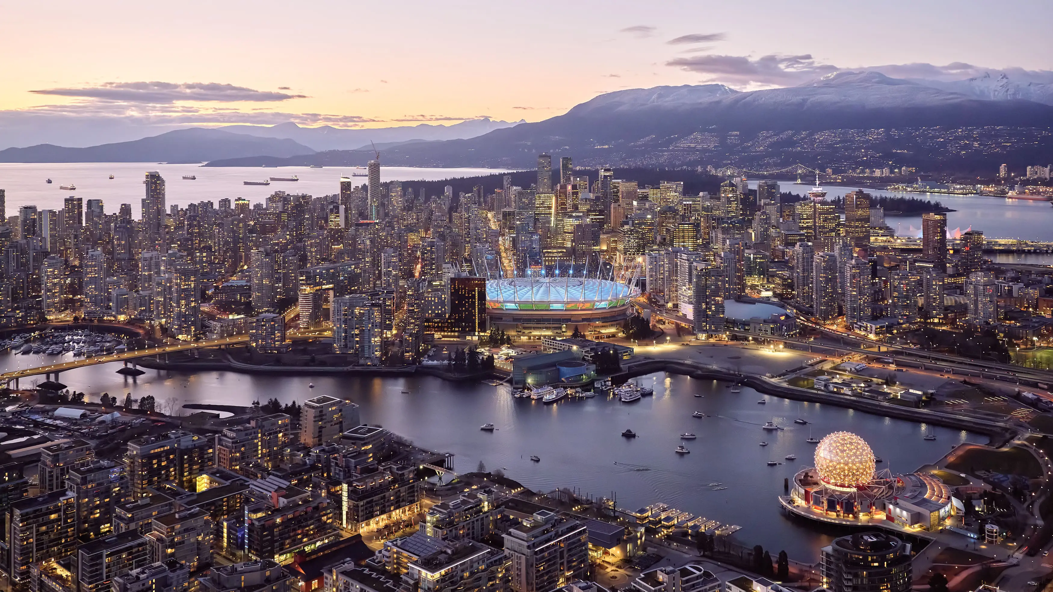 BC Place stadium glowing at dusk in the Vancouver skyline, a 2026 World Cup venue